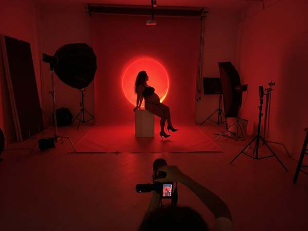 Portrait shoot with red lighting in the photography studio at Kreators by bridgr in Lisbon
